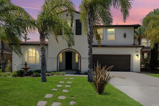 33740 Sattui St, Temecula, CA 92592 - mediterranean / spanish house featuring an attached garage, stucco siding, concrete driveway, a front yard, and a tile roof