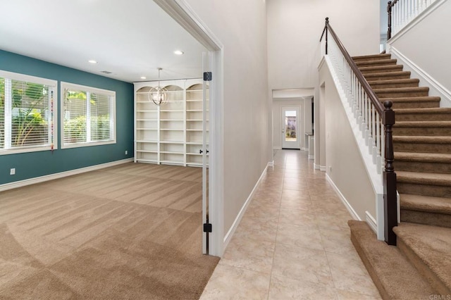 33740 Sattui St, Temecula, CA 92592 - foyer featuring stairs, recessed lighting, light tile patterned floors, light colored carpet, and a chandelier