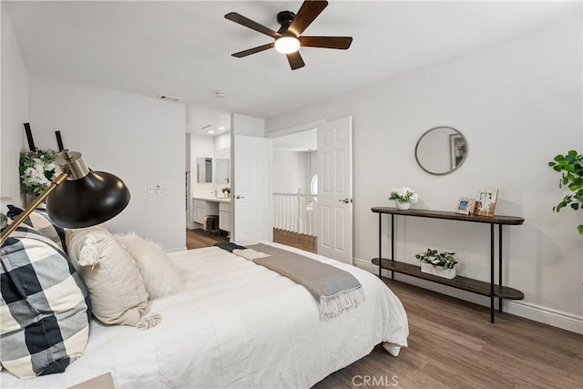 34 Carmel Ct, Laguna Beach, CA 92651 - bedroom featuring wood finished floors, connected bathroom, and ceiling fan