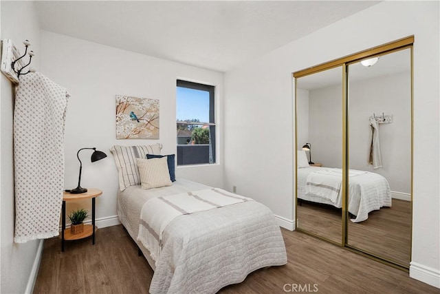 34 Carmel Ct, Laguna Beach, CA 92651 - bedroom with a closet and wood finished floors