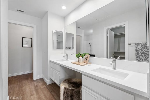 34 Carmel Ct, Laguna Beach, CA 92651 - full bath featuring double vanity and wood finished floors