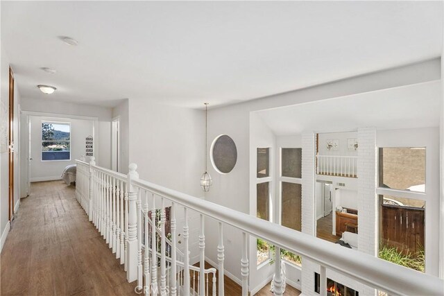 34 Carmel Ct, Laguna Beach, CA 92651 - hallway with an upstairs landing and wood finished floors