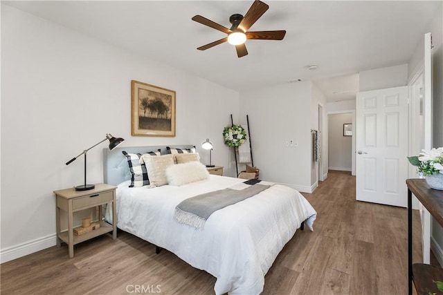 34 Carmel Ct, Laguna Beach, CA 92651 - bedroom with wood finished floors and a ceiling fan
