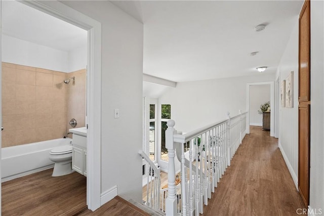 34 Carmel Ct, Laguna Beach, CA 92651 - hall featuring wood finished floors and an upstairs landing