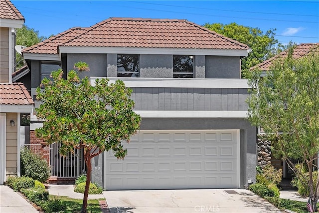 34 Carmel Ct, Laguna Beach, CA 92651 - view of front of property featuring a tile roof, stucco siding, and driveway