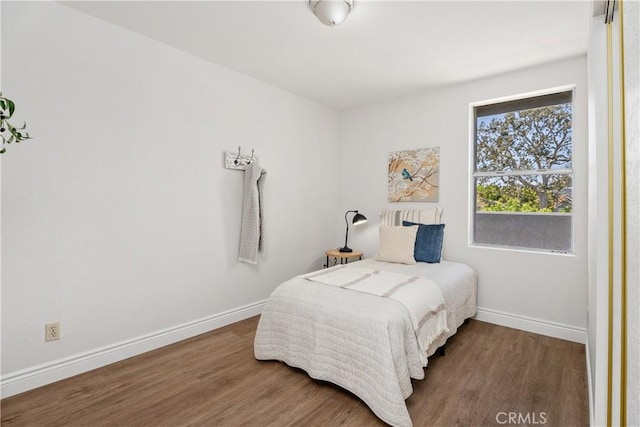 34 Carmel Ct, Laguna Beach, CA 92651 - bedroom featuring wood finished floors and baseboards