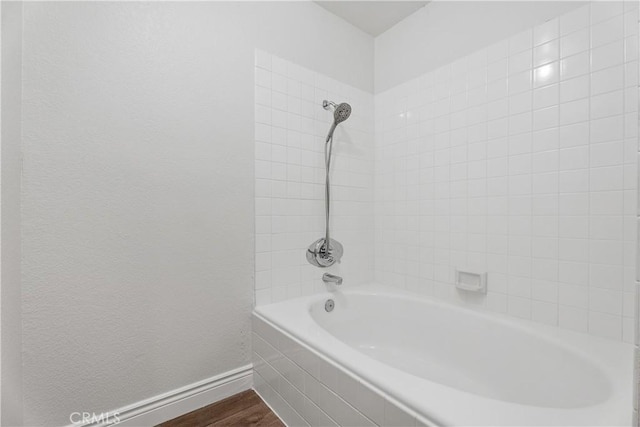 34 Carmel Ct, Laguna Beach, CA 92651 - full bathroom featuring wood finished floors and shower / bath combination