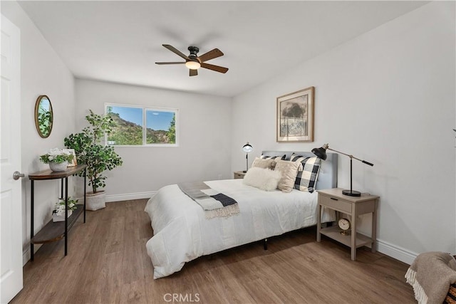 34 Carmel Ct, Laguna Beach, CA 92651 - bedroom featuring wood finished floors and a ceiling fan