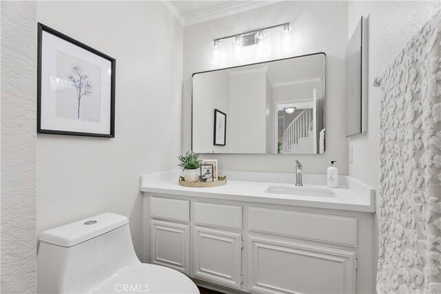 34 Carmel Ct, Laguna Beach, CA 92651 - bathroom with ornamental molding and vanity