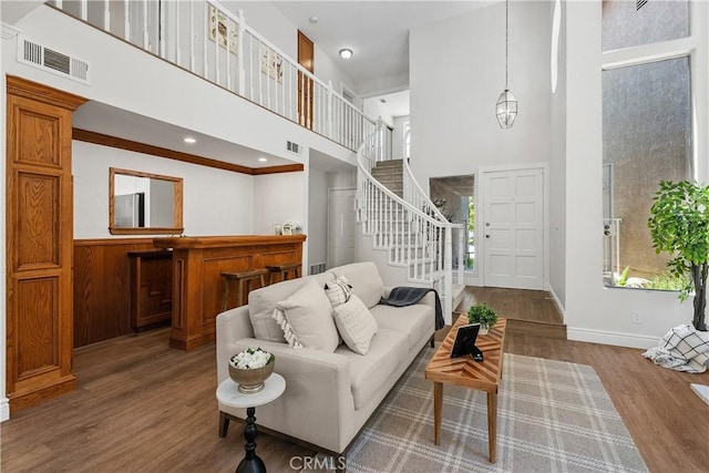 34 Carmel Ct, Laguna Beach, CA 92651 - living area with a high ceiling, stairs, and wood finished floors