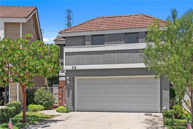 34 Carmel Ct, Laguna Beach, CA 92651 - view of front of home featuring stucco siding, a tiled roof, and concrete driveway