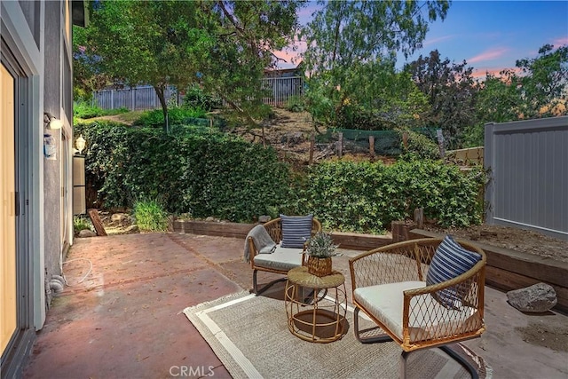 34 Carmel Ct, Laguna Beach, CA 92651 - patio terrace at dusk with a patio and a fenced backyard