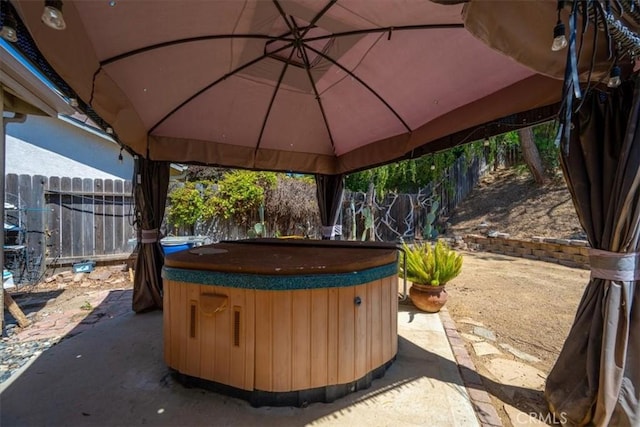 935 Running Stag Way, Paso Robles, CA 93446 - fenced backyard featuring a hot tub, a gazebo, and a patio