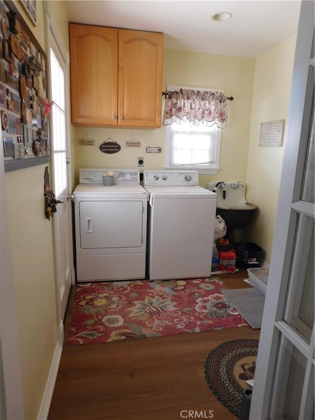 620 N La Sena Ave, West Covina, CA 91790 - laundry area featuring cabinet space, independent washer and dryer, and wood finished floors