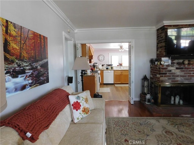 620 N La Sena Ave, West Covina, CA 91790 - living room featuring wood finished floors, crown molding, a brick fireplace, and a ceiling fan