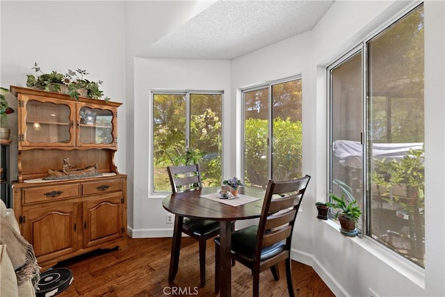 42244 Cosmic Dr, Temecula, CA 92592 - dining room with dark wood-type flooring and a textured ceiling