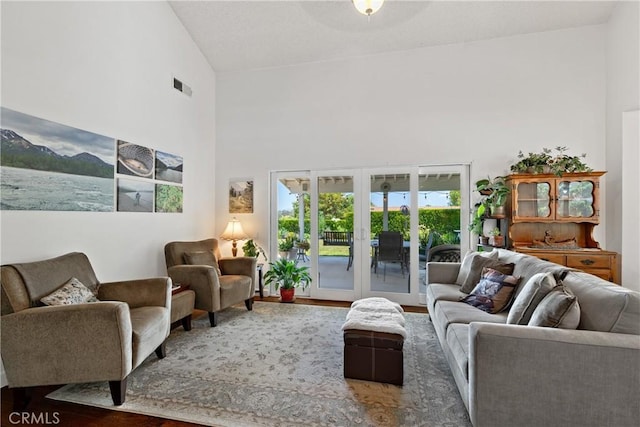 42244 Cosmic Dr, Temecula, CA 92592 - living room with a towering ceiling, french doors, and wood finished floors