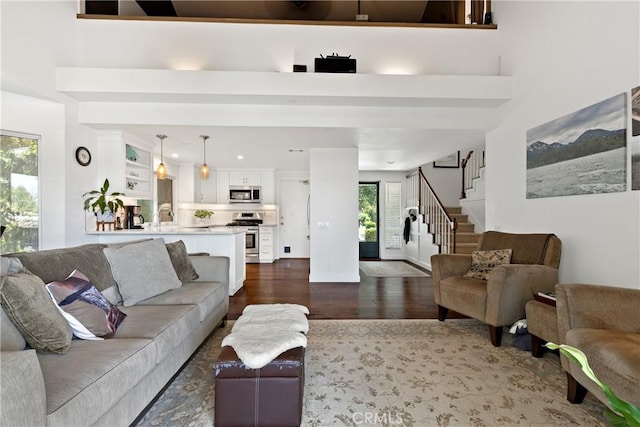 42244 Cosmic Dr, Temecula, CA 92592 - living room featuring dark wood-style flooring and stairway