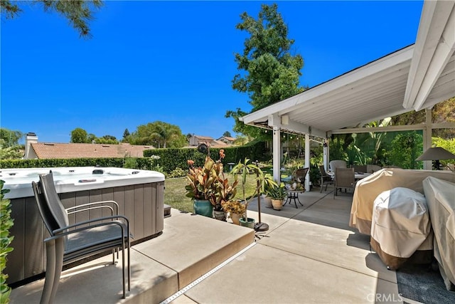 42244 Cosmic Dr, Temecula, CA 92592 - view of patio / terrace featuring a hot tub and outdoor dining space