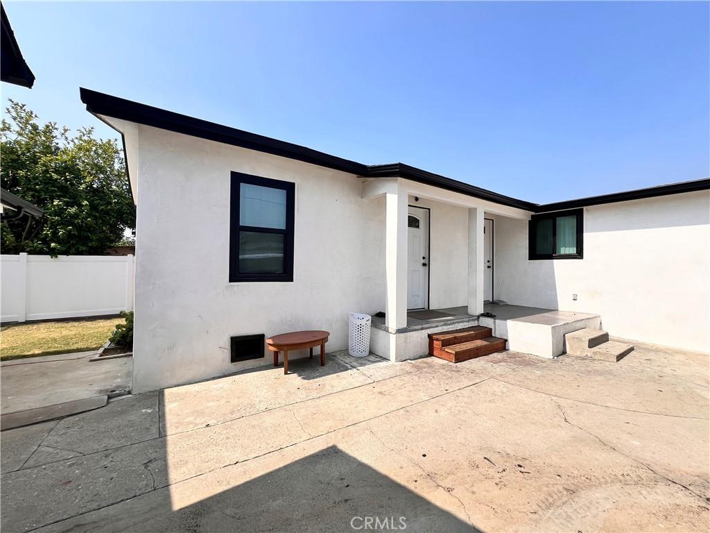 326 S Mcbride Ave, Los Angeles, CA 90022 - view of front of property featuring stucco siding and a patio