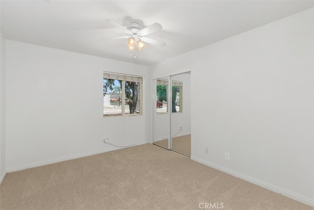 21285 Shoemaker Ln, Wildomar, CA 92595 - unfurnished bedroom with light colored carpet, a closet, and a ceiling fan