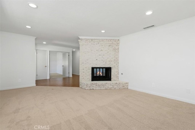 21285 Shoemaker Ln, Wildomar, CA 92595 - unfurnished living room with recessed lighting, carpet floors, ornamental molding, and a fireplace
