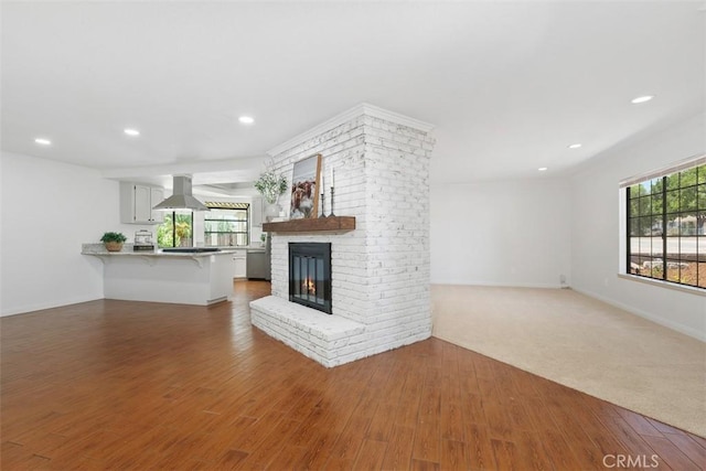 21285 Shoemaker Ln, Wildomar, CA 92595 - unfurnished living room featuring wood finished floors, a brick fireplace, and recessed lighting