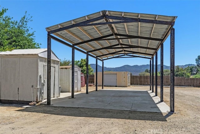 21285 Shoemaker Ln, Wildomar, CA 92595 - view of vehicle parking with a shed, a detached carport, and a mountain view