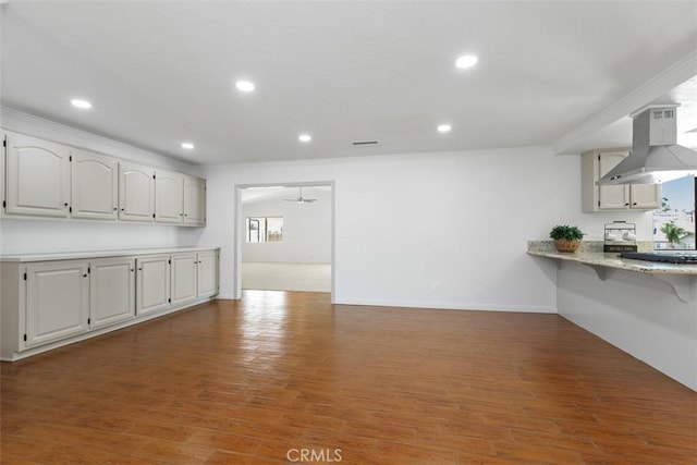 21285 Shoemaker Ln, Wildomar, CA 92595 - kitchen with range hood, ornamental molding, wood finished floors, recessed lighting, and healthy amount of natural light