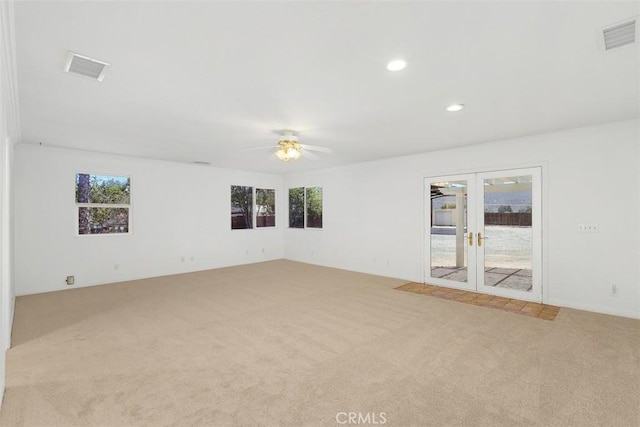 21285 Shoemaker Ln, Wildomar, CA 92595 - empty room with light carpet, french doors, healthy amount of natural light, and recessed lighting