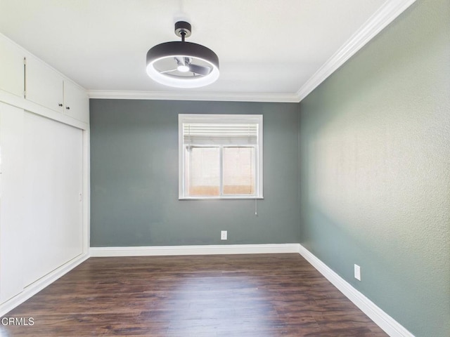 2025 N Chouteau St, Orange, CA 92865 - unfurnished bedroom with crown molding, dark wood finished floors, and a closet