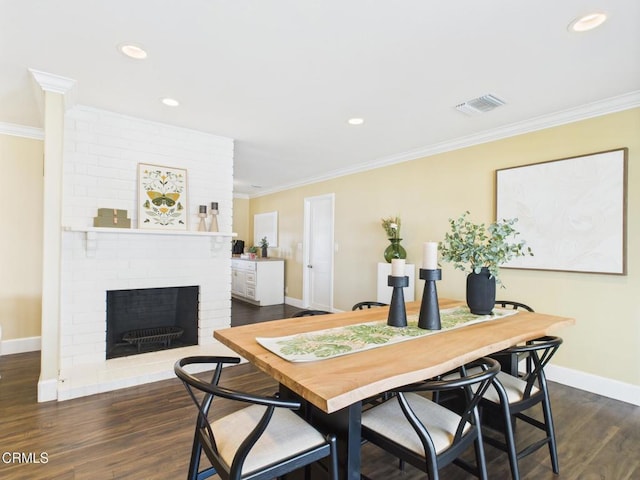 2025 N Chouteau St, Orange, CA 92865 - dining area featuring ornamental molding, dark wood finished floors, a brick fireplace, and recessed lighting