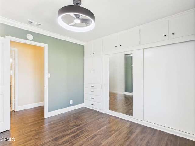 2025 N Chouteau St, Orange, CA 92865 - unfurnished bedroom featuring ornamental molding, dark wood finished floors, and a closet