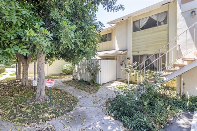 16755 Parthenia St Unit 5, Northridge, CA 91343 - view of property exterior with stairway and stucco siding