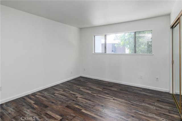 16755 Parthenia St Unit 5, Northridge, CA 91343 - unfurnished room featuring dark wood-style flooring and baseboards