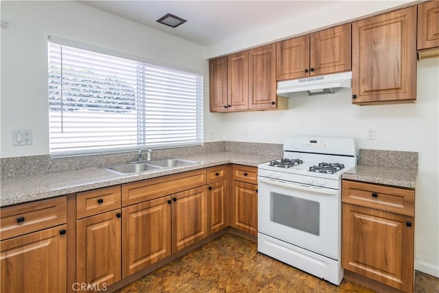 16755 Parthenia St Unit 5, Northridge, CA 91343 - kitchen with gas range gas stove, under cabinet range hood, brown cabinetry, and light countertops