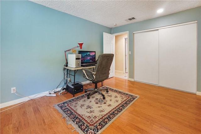 1129 Walnut Grove Ave, Rosemead, CA 91770 - office area with wood finished floors and a textured ceiling