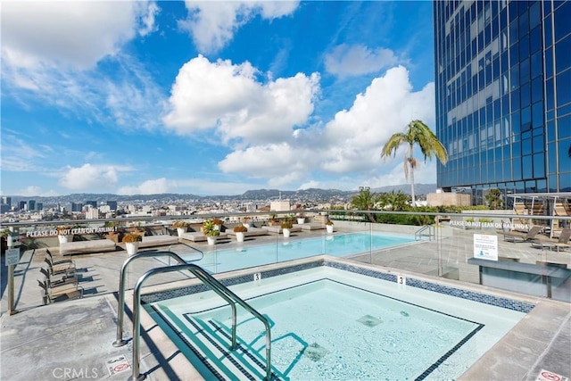1100 Wilshire Blvd Unit 1707, Los Angeles, CA 90017 - community pool featuring a city view and a hot tub