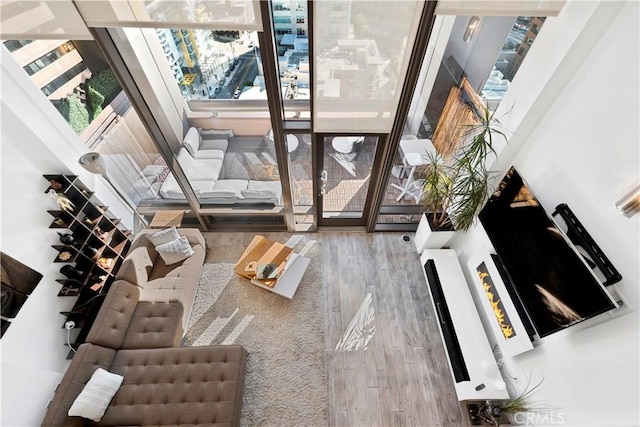1100 Wilshire Blvd Unit 1707, Los Angeles, CA 90017 - living room featuring healthy amount of natural light and wood finished floors