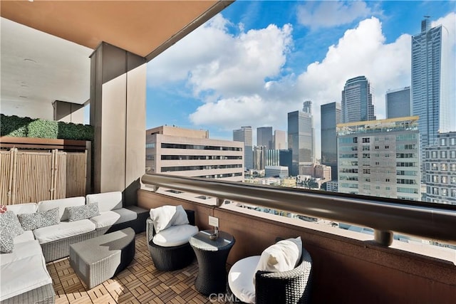 1100 Wilshire Blvd Unit 1707, Los Angeles, CA 90017 - balcony with an outdoor hangout area and a skyline view