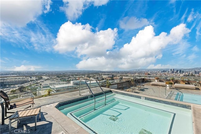 1100 Wilshire Blvd Unit 1707, Los Angeles, CA 90017 - view of pool with a community hot tub, a view of city, and a swimming pool