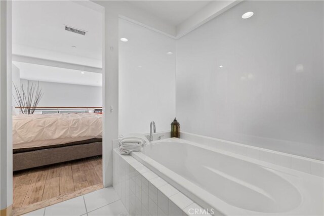 1100 Wilshire Blvd Unit 1707, Los Angeles, CA 90017 - ensuite bathroom featuring a bath and tile patterned flooring