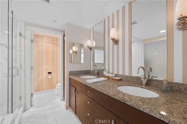 1100 Wilshire Blvd Unit 1707, Los Angeles, CA 90017 - full bathroom featuring double vanity, a stall shower, wallpapered walls, and tile patterned floors