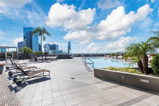 1100 Wilshire Blvd Unit 1707, Los Angeles, CA 90017 - community pool featuring a patio and a view of skyline