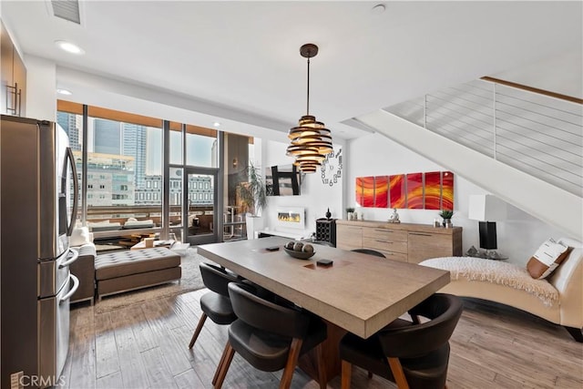 1100 Wilshire Blvd Unit 1707, Los Angeles, CA 90017 - dining space with wood finished floors and recessed lighting