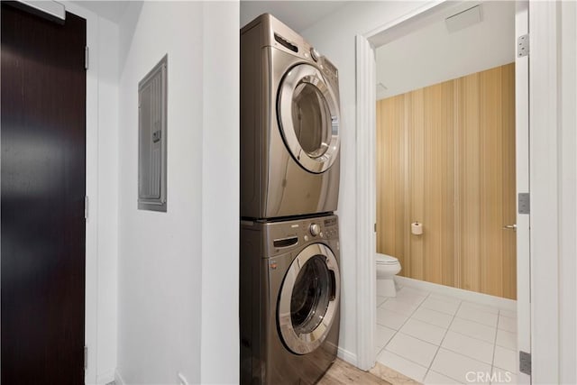 1100 Wilshire Blvd Unit 1707, Los Angeles, CA 90017 - laundry area with estacked washer and dryer and tile patterned flooring