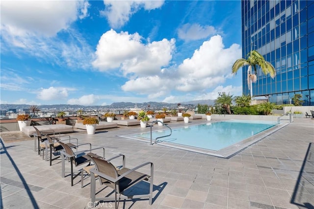 1100 Wilshire Blvd Unit 1707, Los Angeles, CA 90017 - community pool with a mountain view and a patio area