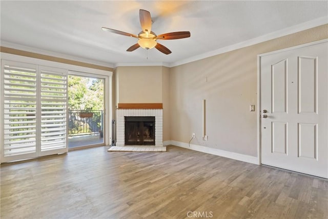 1710 S El Camino Real Unit E204, Encinitas, CA 92024 - unfurnished living room with ceiling fan, wood finished floors, crown molding, and a fireplace