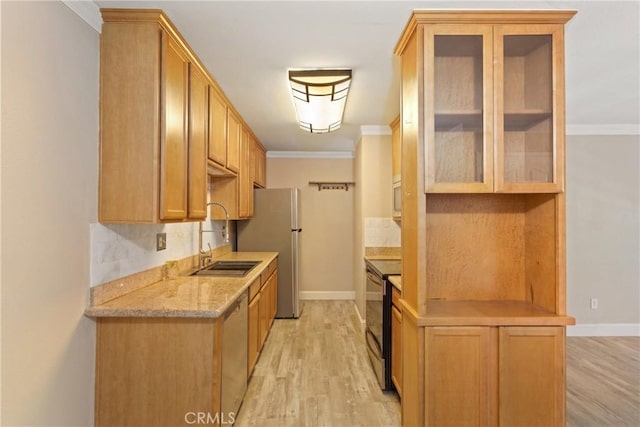 1710 S El Camino Real Unit E204, Encinitas, CA 92024 - kitchen featuring appliances with stainless steel finishes, light wood-style floors, crown molding, glass insert cabinets, and backsplash