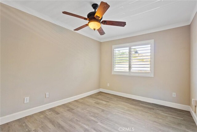 1710 S El Camino Real Unit E204, Encinitas, CA 92024 - spare room featuring light wood-type flooring, ceiling fan, and crown molding